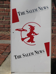 Salem News sandwitch sign with emblem