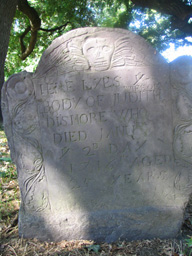 tombstone 1716 with winged skull design